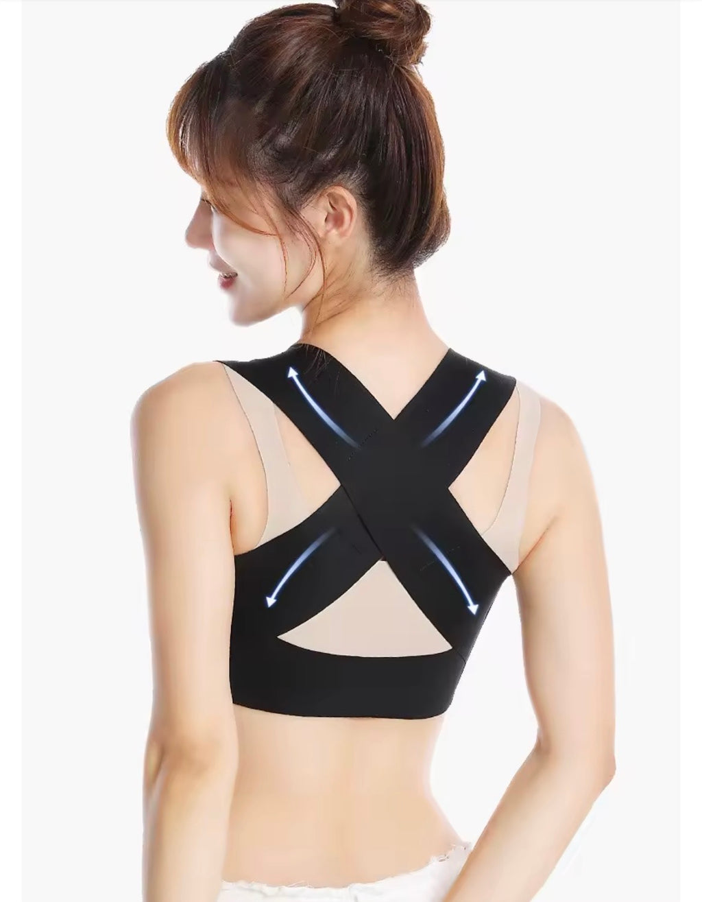Correcteur de posture noir pour femme, vue arrière sur modèle, avec larges bretelles croisées en X dans le dos.